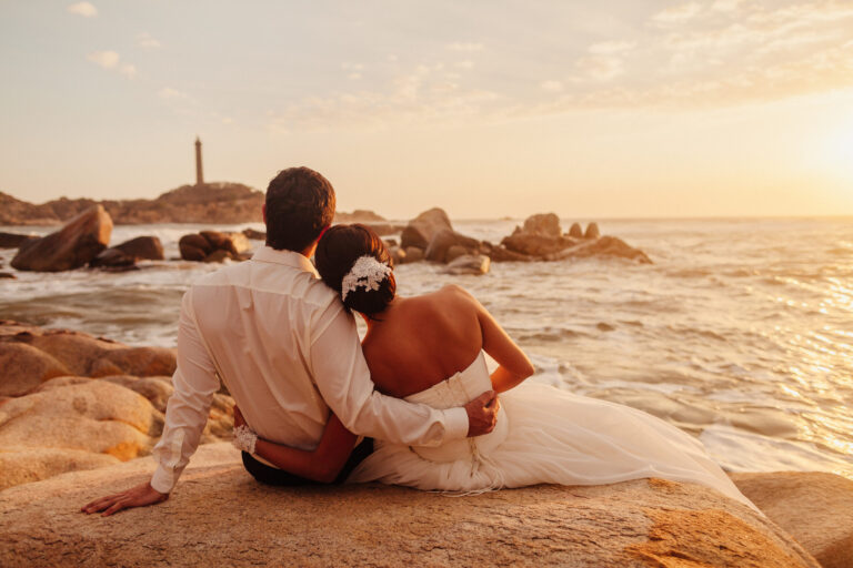 Couple embracing on sunset beach, honeymoon destination, travel and leisure.
